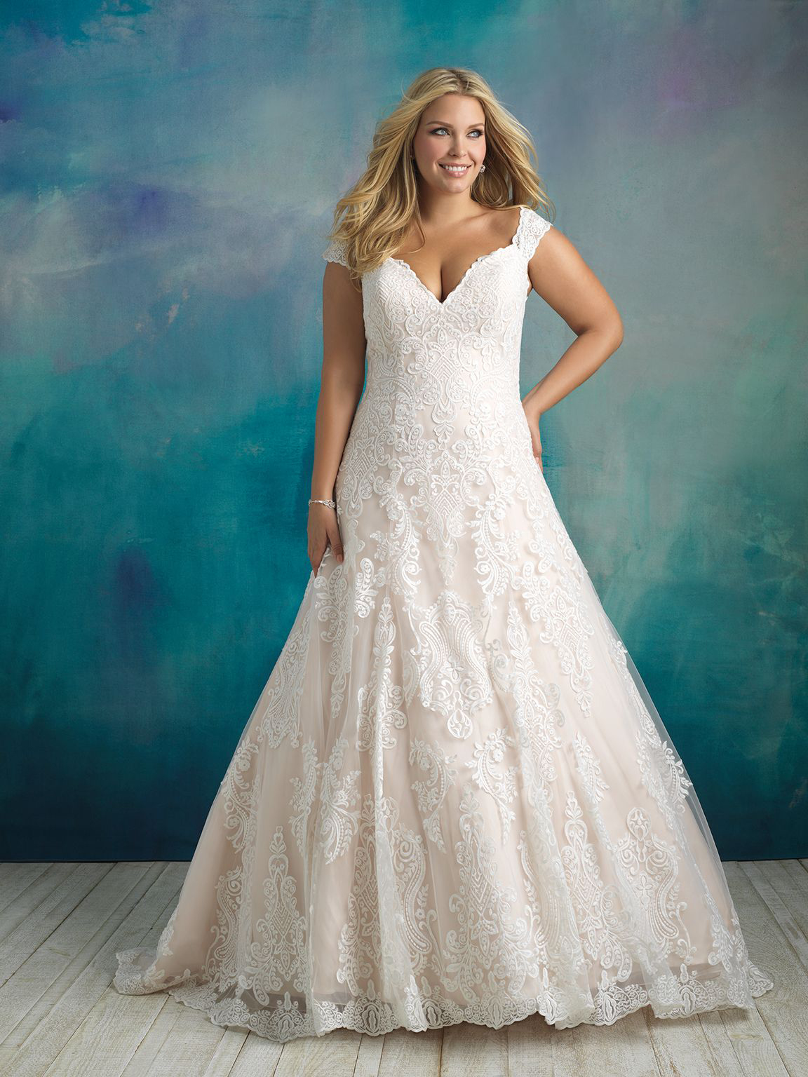 Plus-size A-line wedding dress with cap sleeves by Allure Bridals