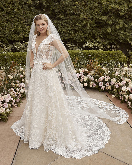 Lace A-line wedding dress with cap sleeves and veil