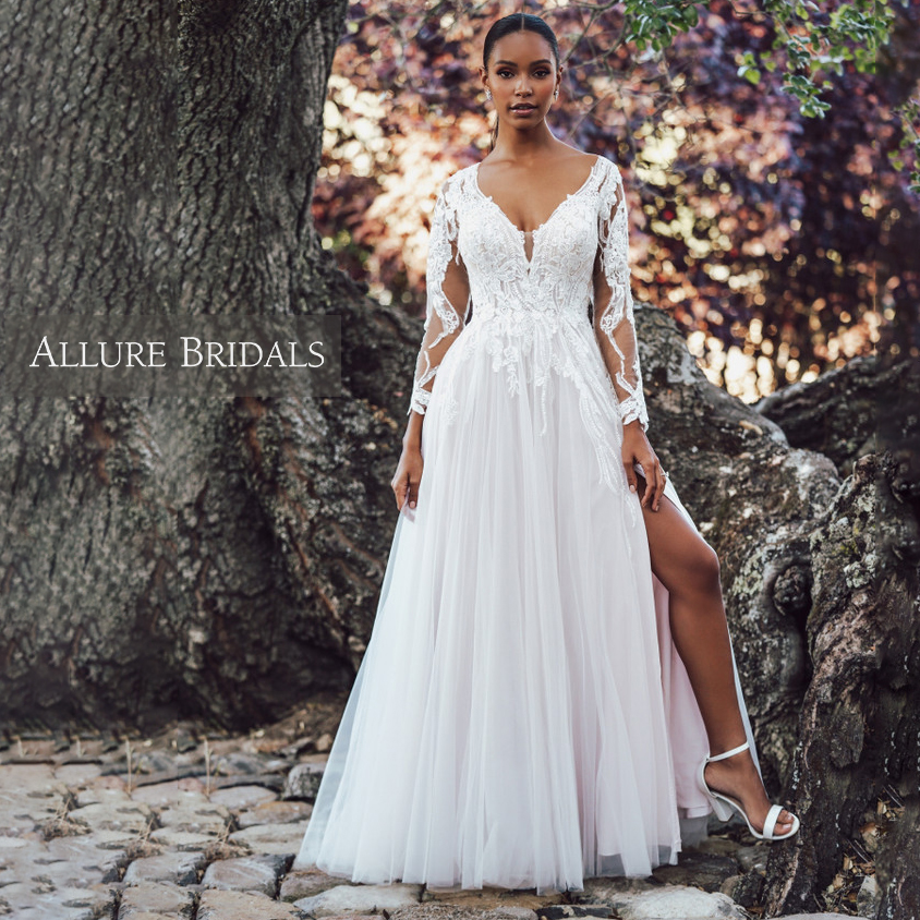A-line bridal gown with long lace sleeves and leg slit