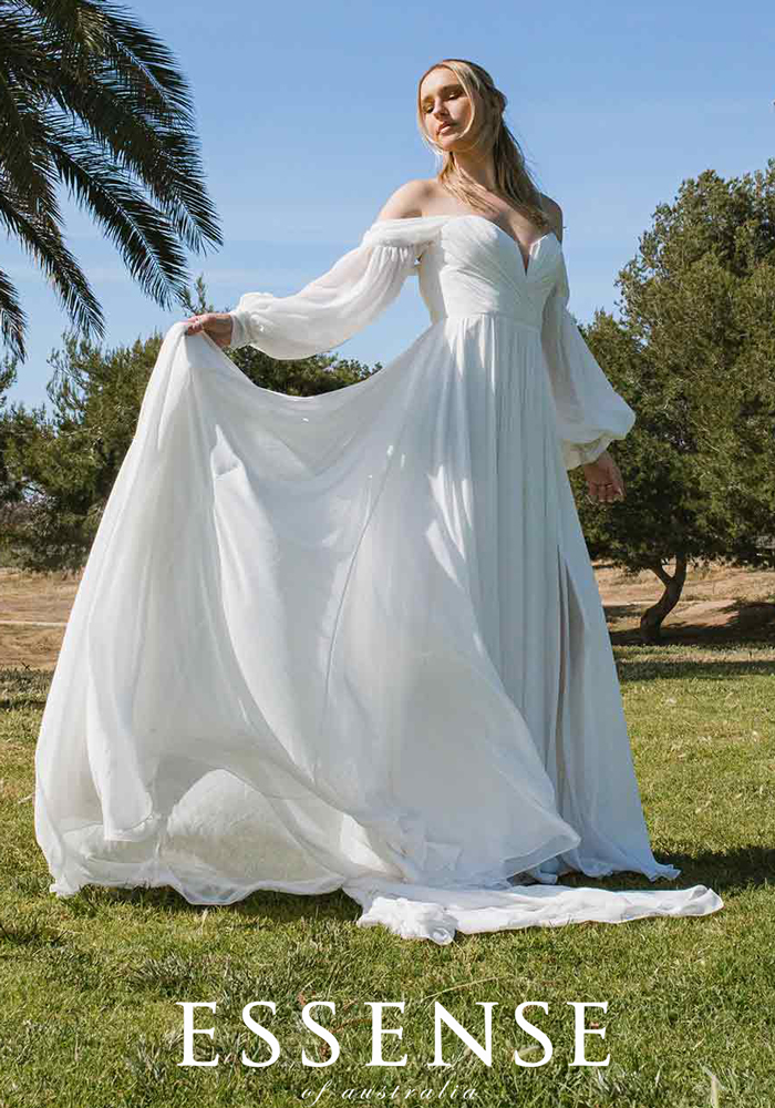 Flowy wedding dress with sleeves by Essense of Australia