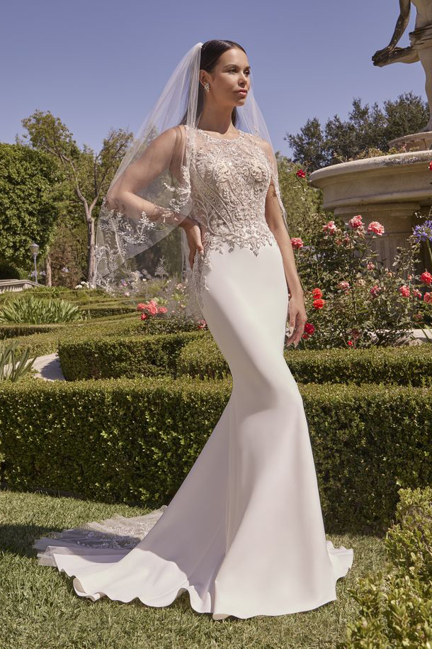 Sleeveless fit-and-flare wedding dress with high neck and veil