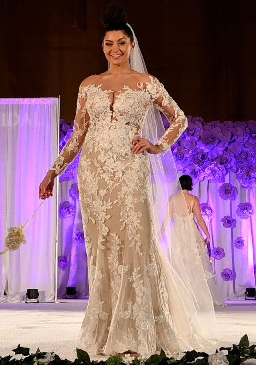Long-sleeved fit-and-flare bridal gown with veil