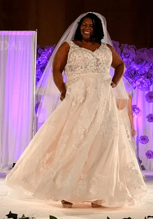Plus-size sleeveless A-line bridal gown with veil